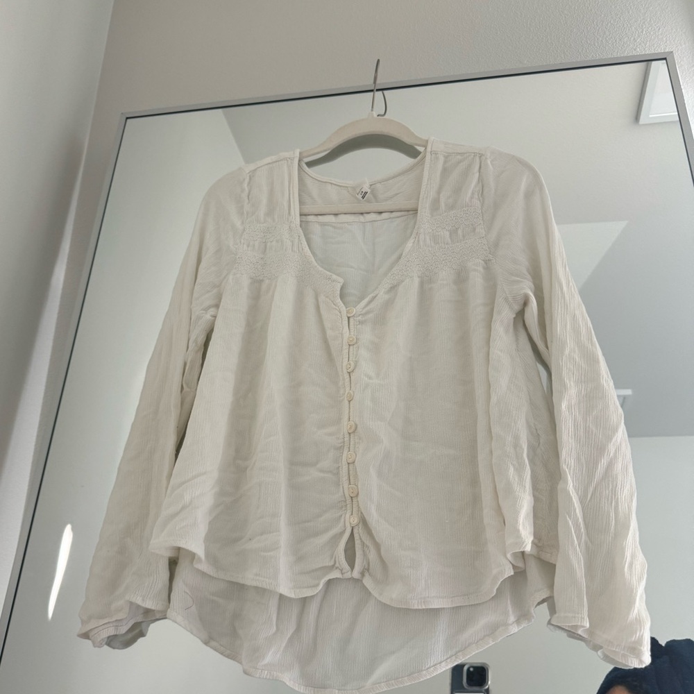 White linen top with embroidered detailing